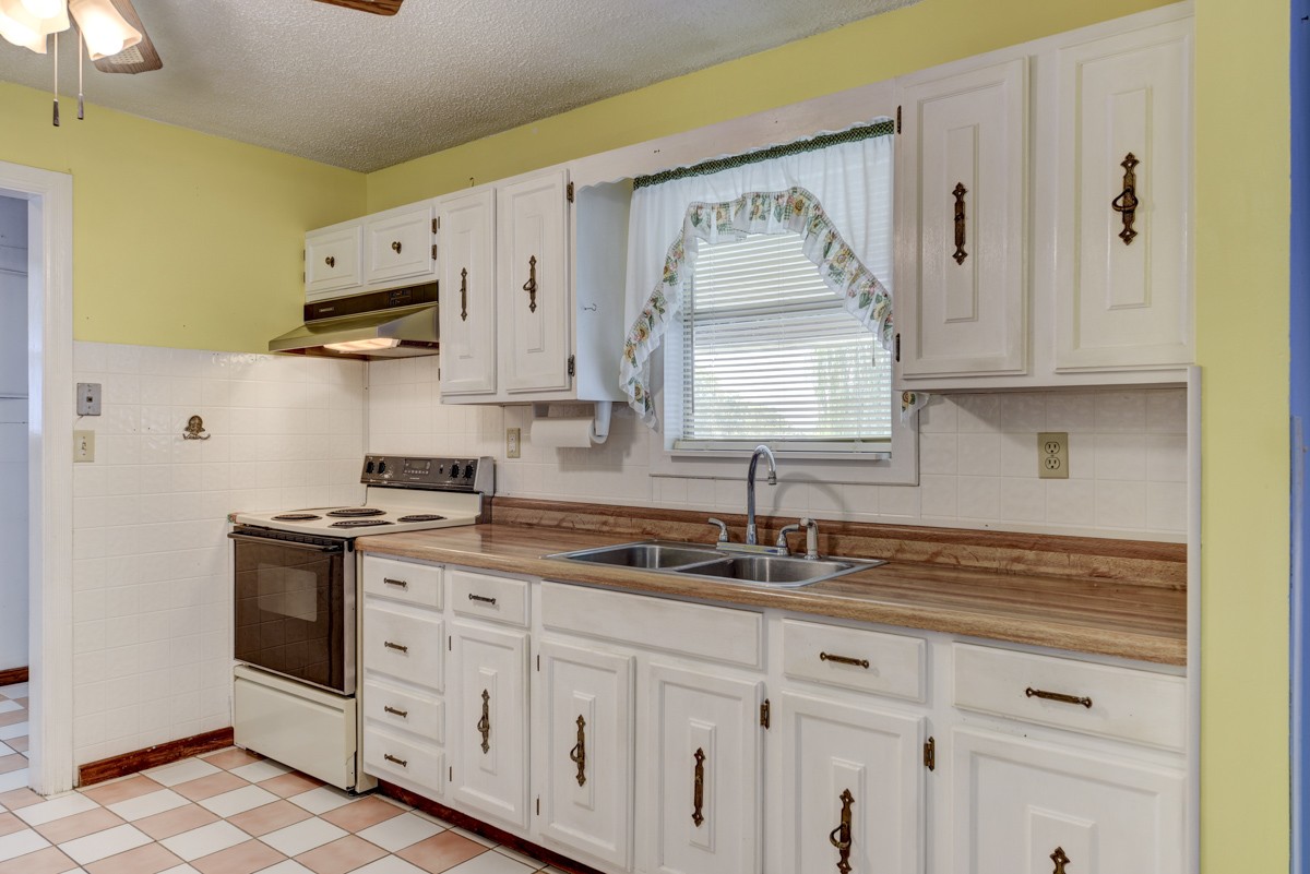 3945 Mitchell Road Lebanon, TN 37087 - Photo 39 of 41 a kitchen with white cabinets and white appliances