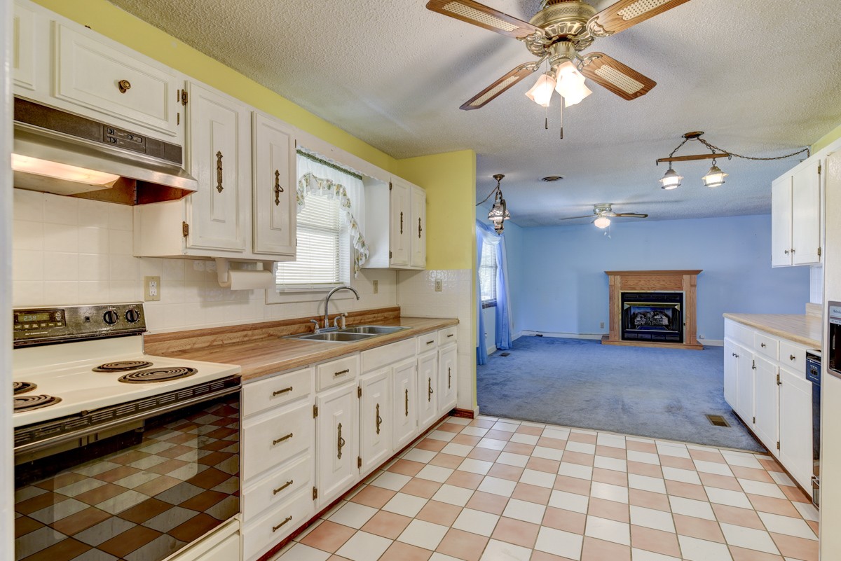 3945 Mitchell Road Lebanon, TN 37087 - Photo 40 of 41 a kitchen with stainless steel appliances granite countertop a stove a sink and a microwave