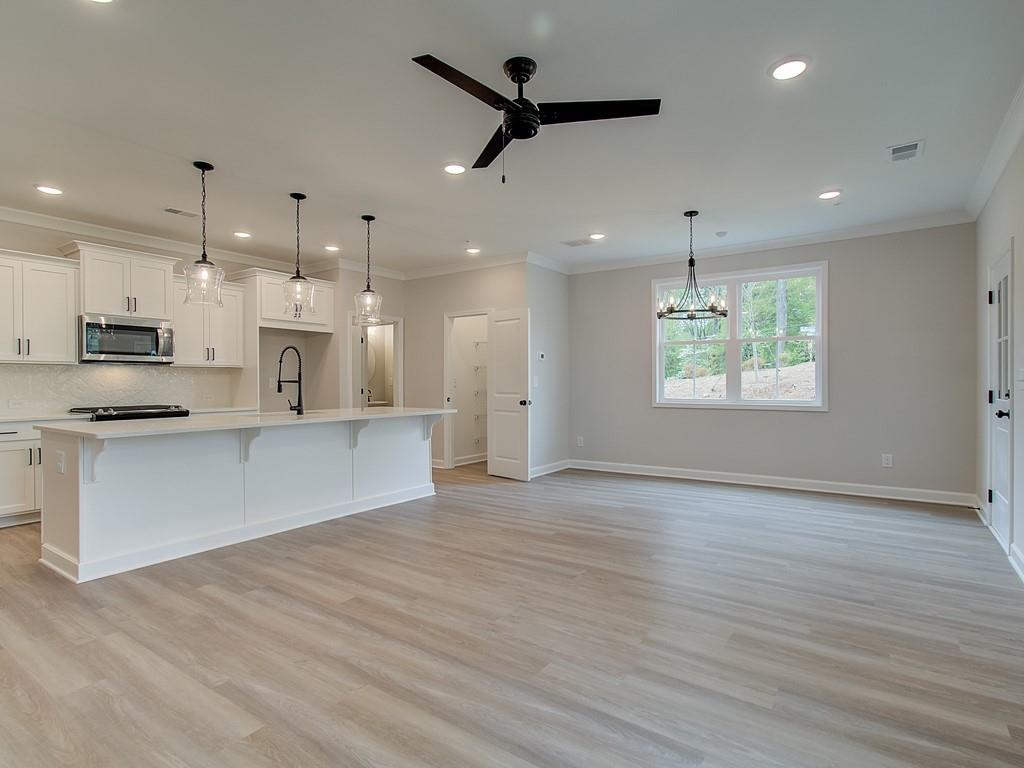 341 Colsen Drive Acworth, GA 30102 - Photo 14 of 36 a view of kitchen with kitchen island wooden floors appliances and cabinets