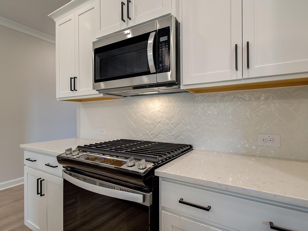 341 Colsen Drive Acworth, GA 30102 - Photo 20 of 36 a kitchen with a stove and a microwave