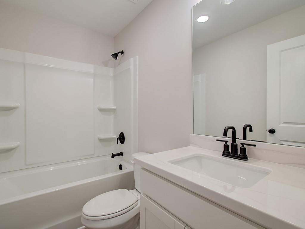 341 Colsen Drive Acworth, GA 30102 - Photo 25 of 36 a bathroom with a sink a toilet and a bathtub