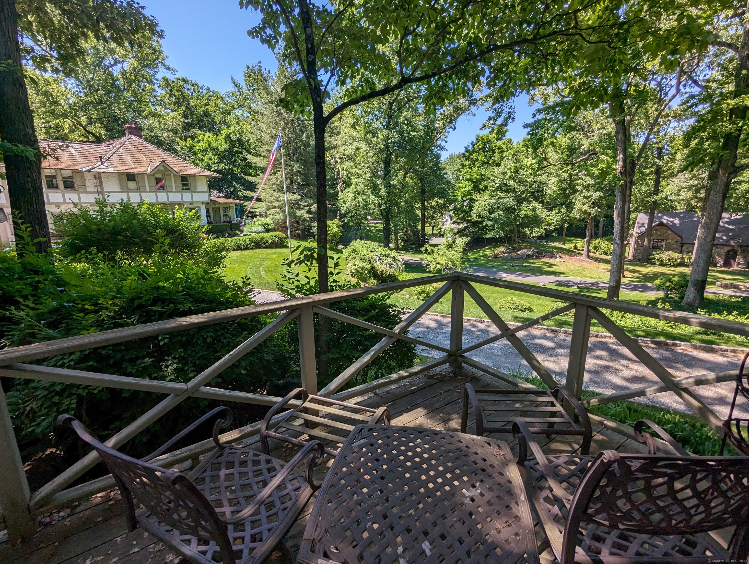3 Wild Rose Lane, Unit COTTAGE Darien, CT 06820 - Photo 11 of 16 a view of trees and patio