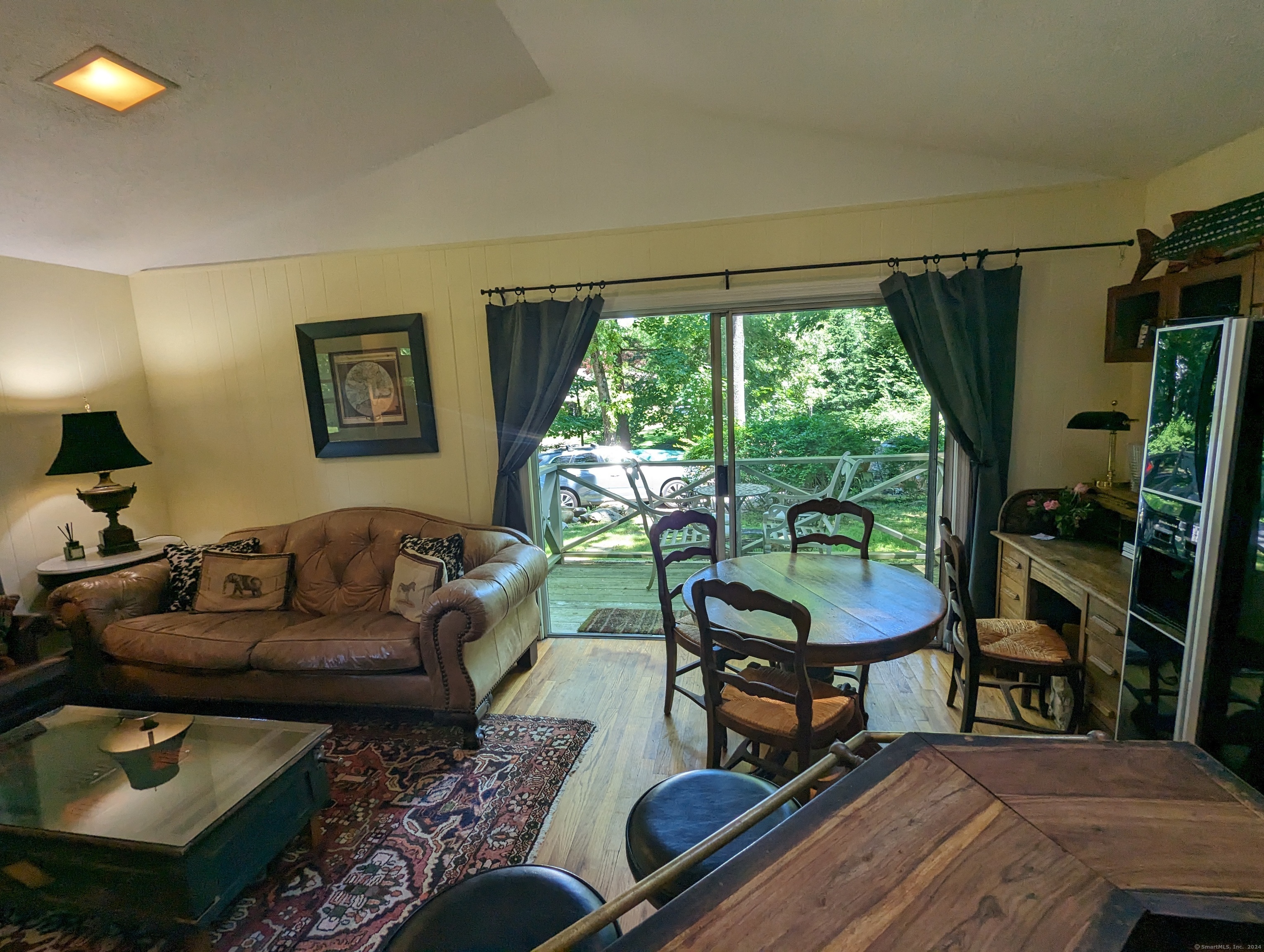 3 Wild Rose Lane, Unit COTTAGE Darien, CT 06820 - Photo 6 of 16 a living room with furniture and a large window