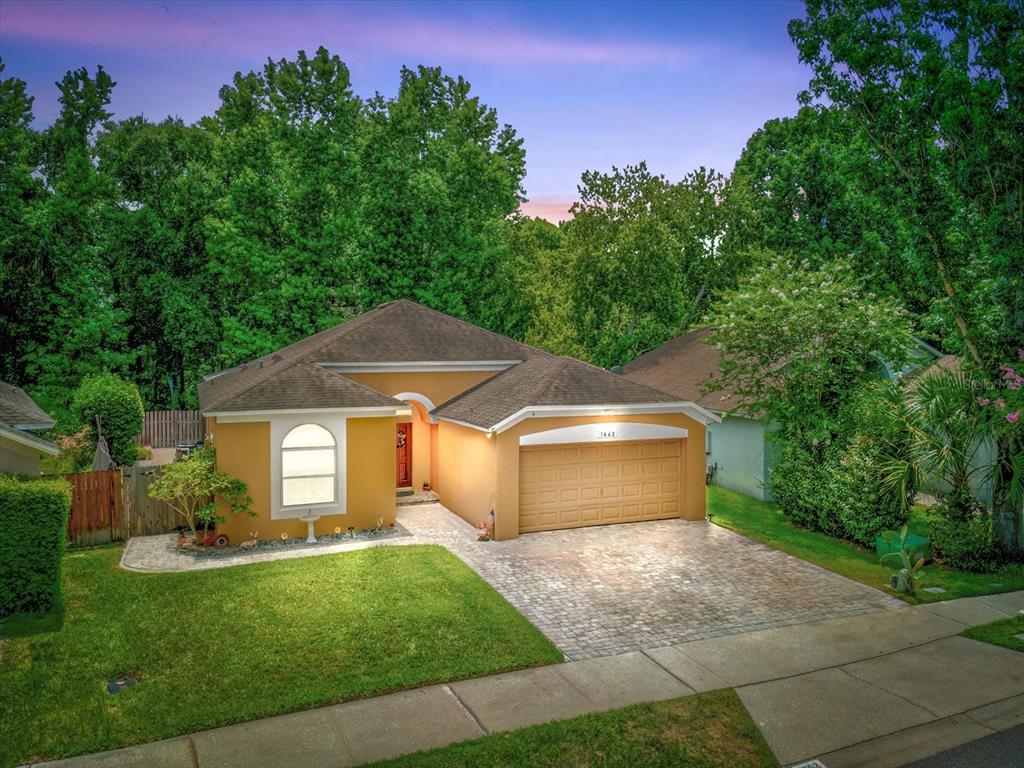 1662 Riveredge Road Oviedo, FL 32766 - Photo 1 of 1 a front view of a house with a yard and trees
