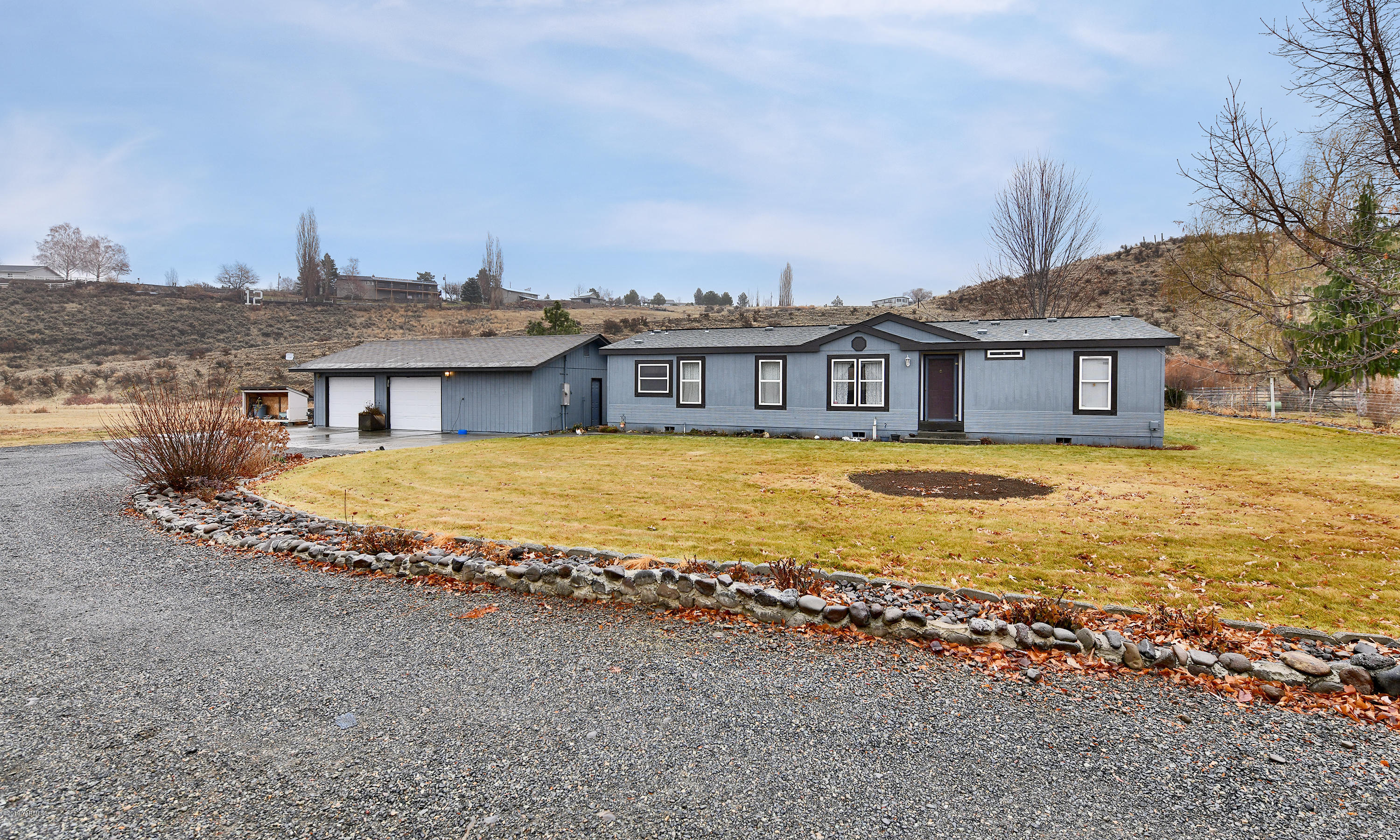 1251 Stone Road Yakima, WA 98908 - Photo 1 of 17 a view of a house with a ocean view