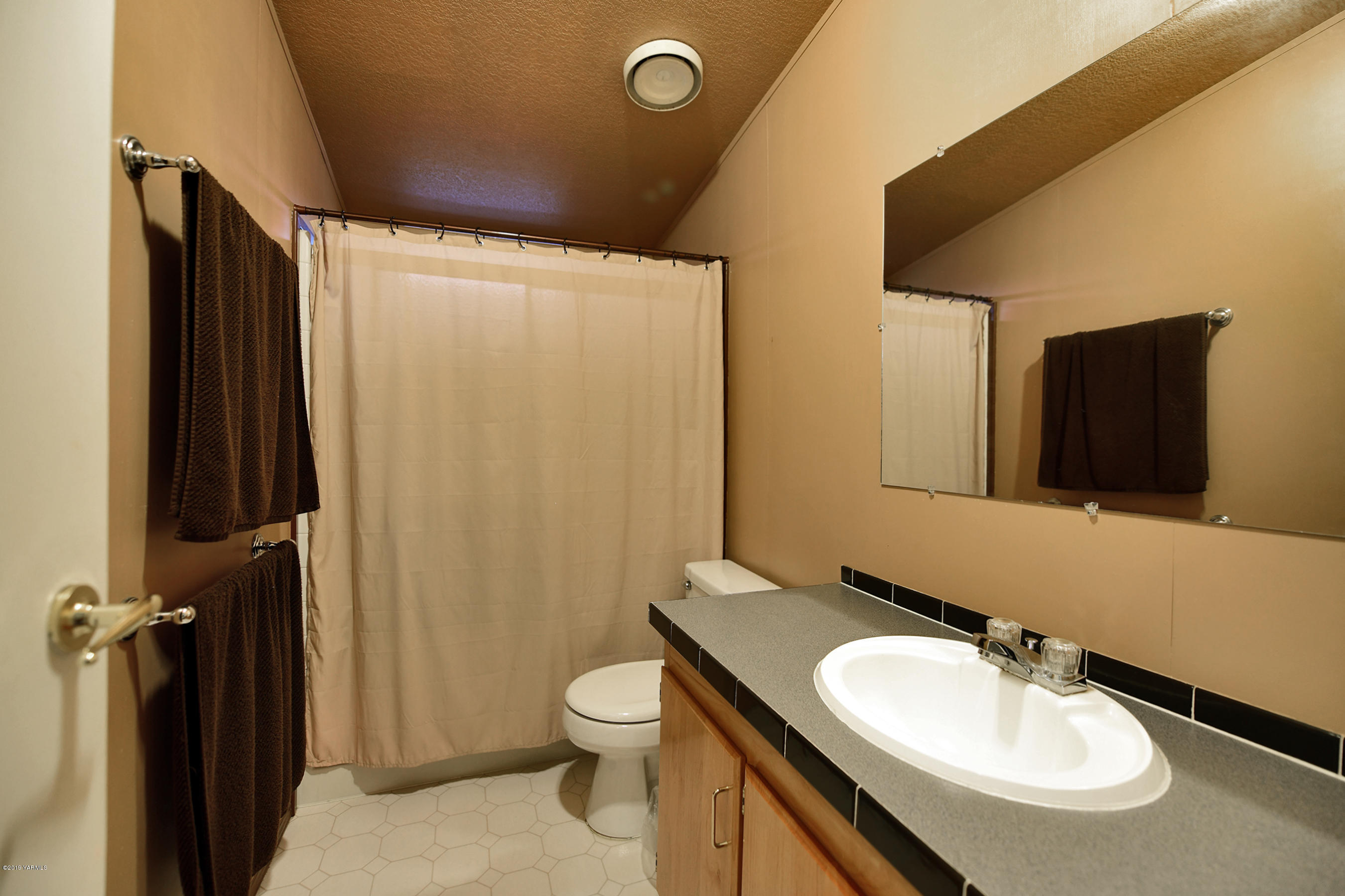 1251 Stone Road Yakima, WA 98908 - Photo 12 of 17 a bathroom with a sink toilet and shower