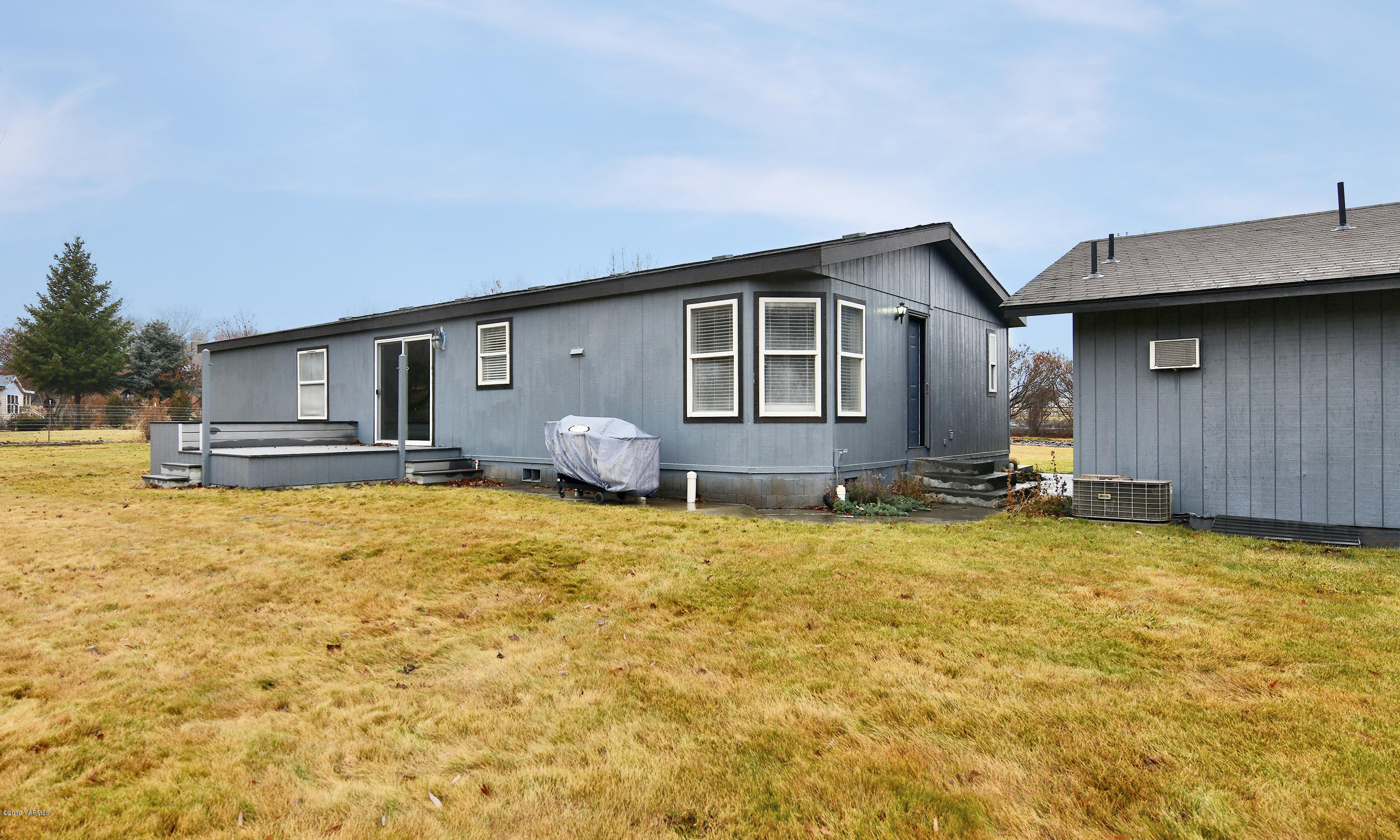 1251 Stone Road Yakima, WA 98908 - Photo 14 of 17 a house view with swimming pool in front of it