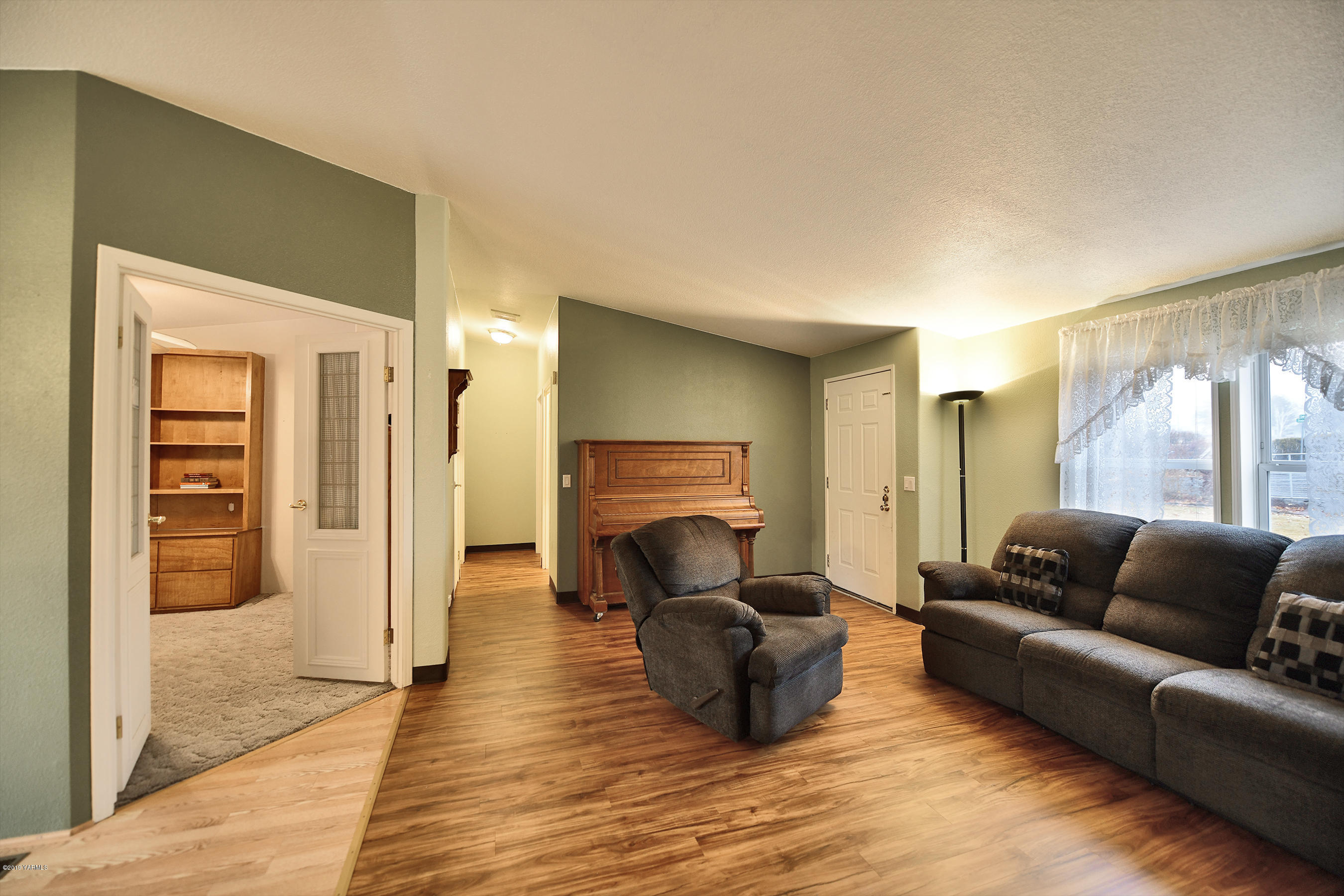 1251 Stone Road Yakima, WA 98908 - Photo 8 of 17 a living room with furniture and a fireplace