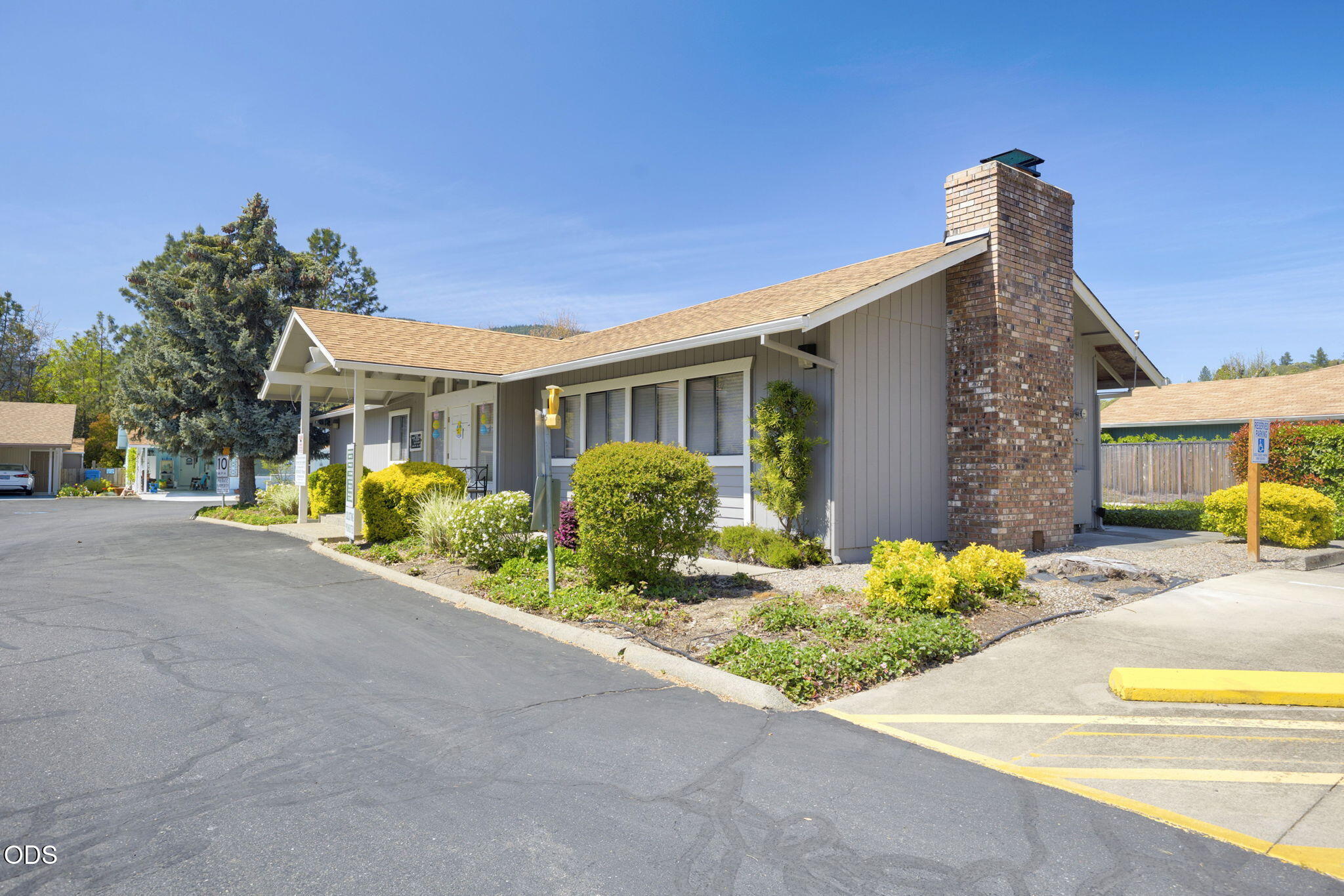 103 Brookside Court Rogue River, OR 97537 - Photo 23 of 27 a front view of a house with a yard and potted plants