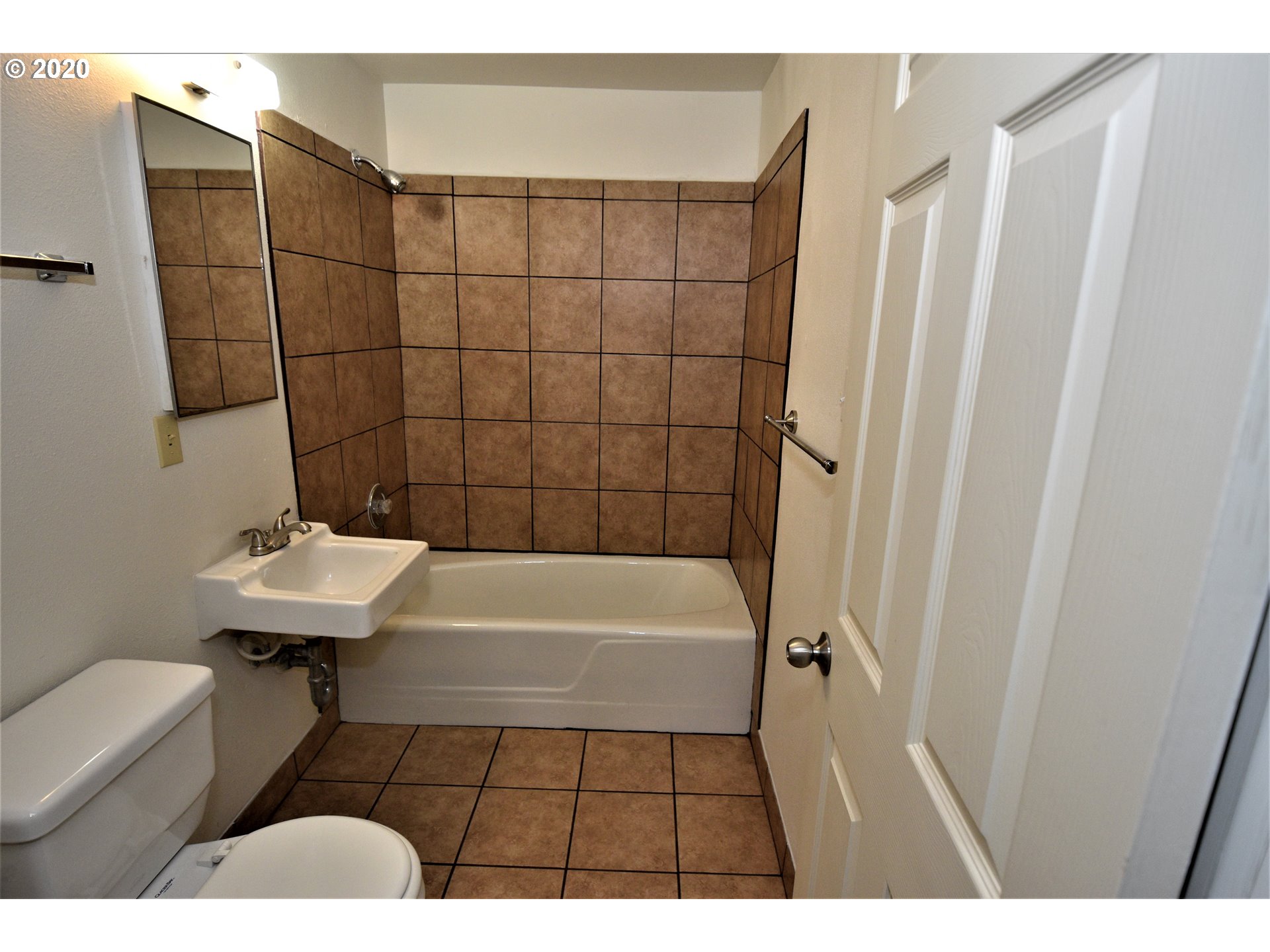1506 Southwest Broadway Drive Portland, OR 97201 - Photo 15 of 18 a bathroom with a sink a toilet and shower