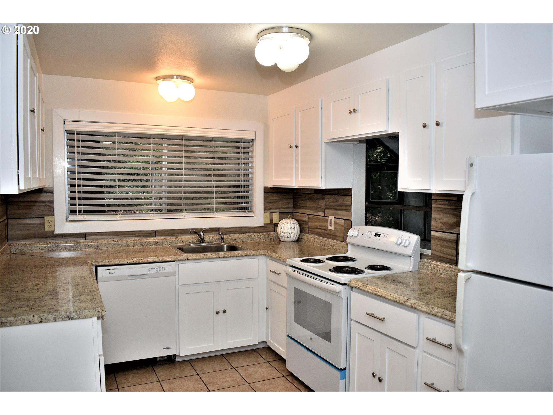 1506 Southwest Broadway Drive Portland, OR 97201 - Photo 5 of 18 a kitchen with stainless steel appliances cabinets a sink and a stove