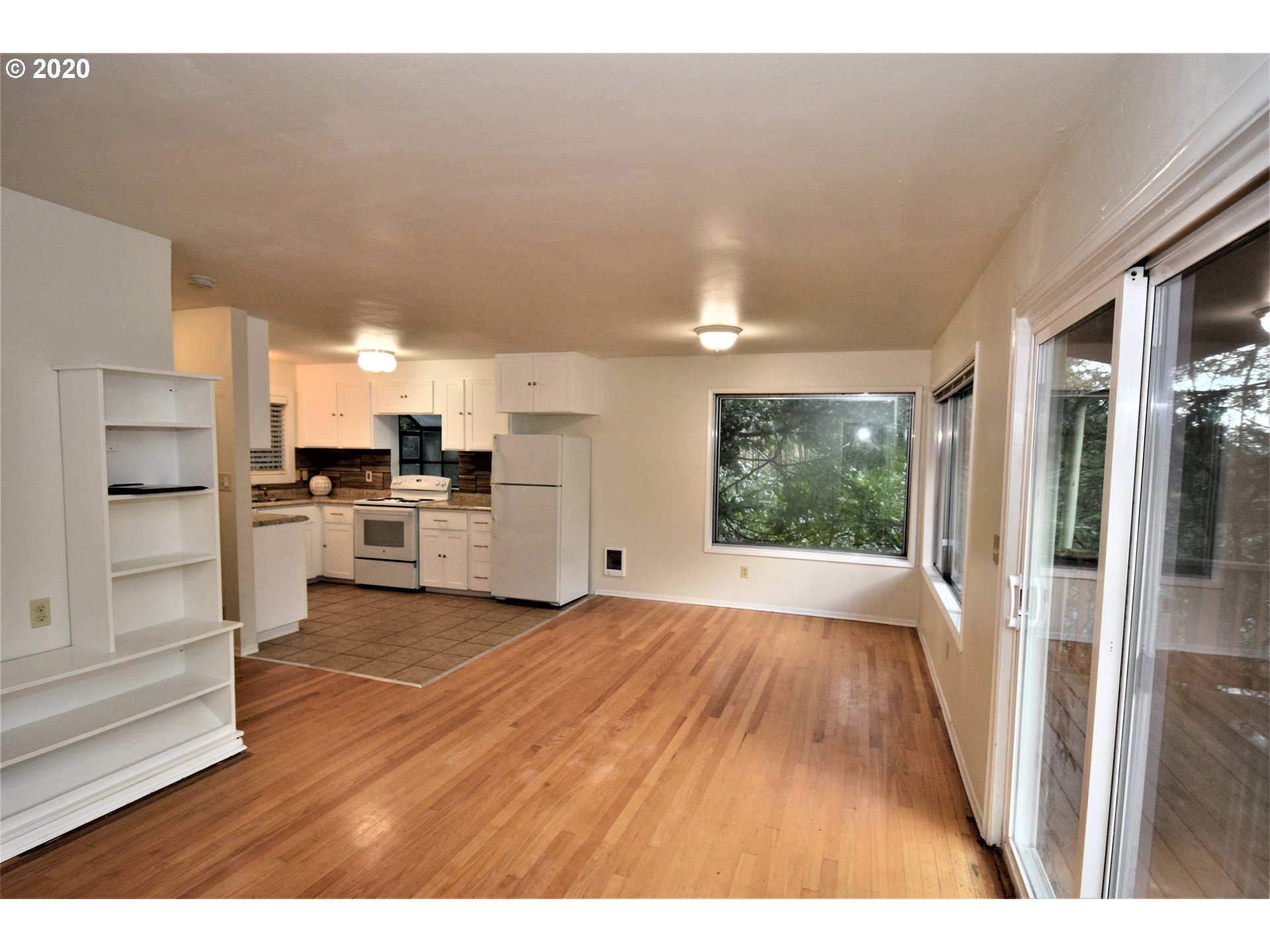 1506 Southwest Broadway Drive Portland, OR 97201 - Photo 7 of 18 a view of a kitchen with wooden floor and a kitchen