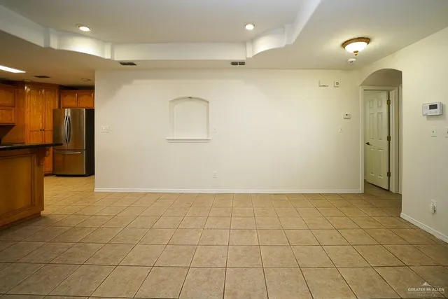 a view of a kitchen with furniture and a ceiling fan