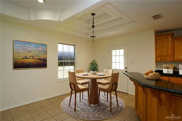 a kitchen with granite countertop a sink stove and cabinets
