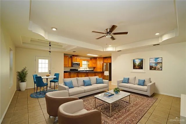 a view of a kitchen with a refrigerator and a sink