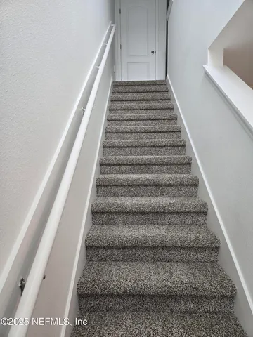 a view of room with furniture and a window