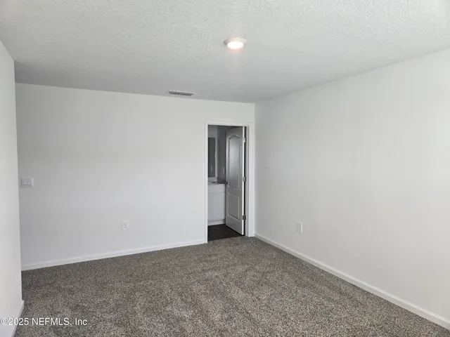 a bathroom with a sink a toilet a mirror and shower