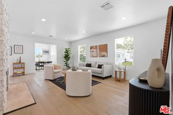 a dining room with furniture and window