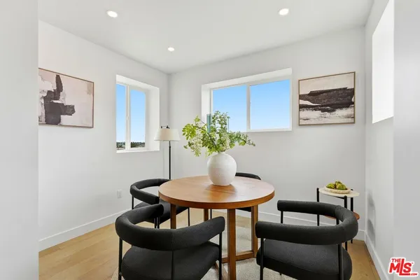 a kitchen with stainless steel appliances a refrigerator and a sink