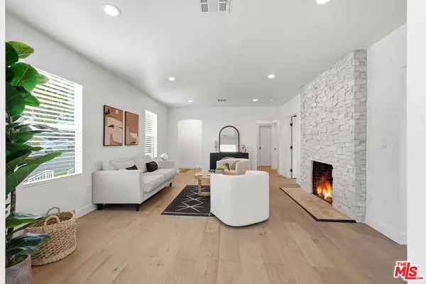 a kitchen with stainless steel appliances a refrigerator sink and microwave