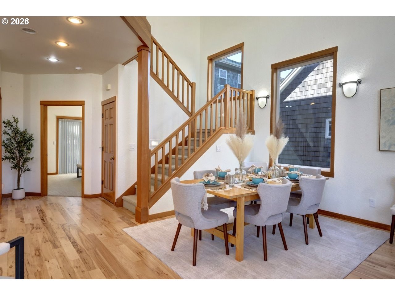 163 West 1st Street Cannon Beach, OR 97110 - Photo 14 of 42 a view of a dining room with furniture and wooden floor