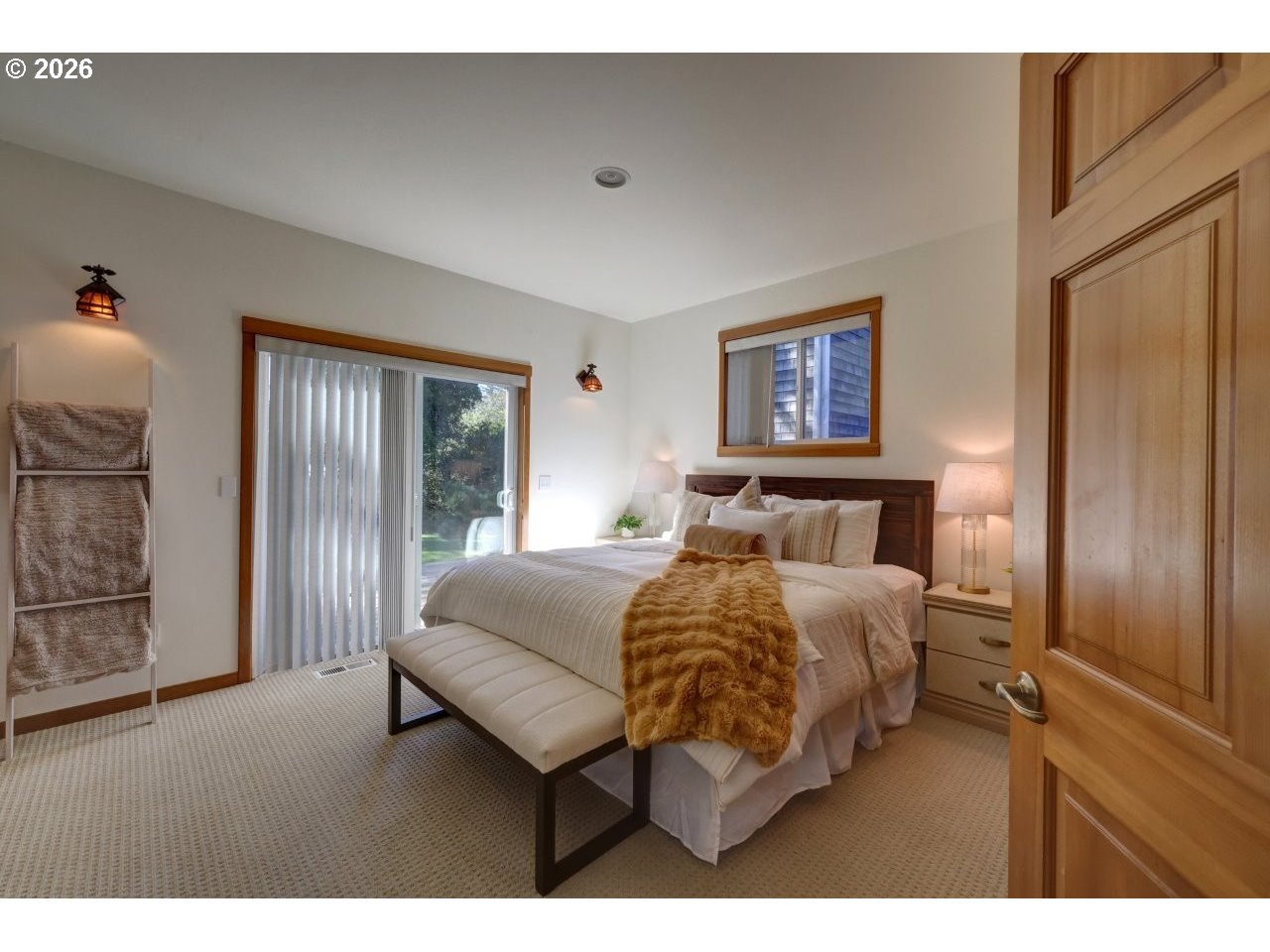 163 West 1st Street Cannon Beach, OR 97110 - Photo 18 of 42 a bedroom with a bed and a night stand