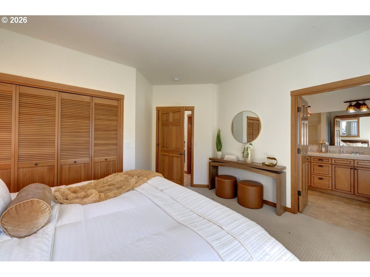 163 West 1st Street Cannon Beach, OR 97110 - Photo 19 of 42 a bedroom with a bed lamps and window