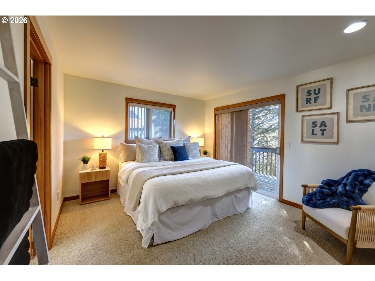 163 West 1st Street Cannon Beach, OR 97110 - Photo 27 of 42 a bedroom with a bed and a window