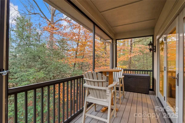 a view of balcony with wooden floor