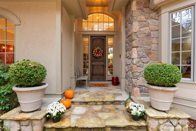 a bathroom with a toilet a sink and a window