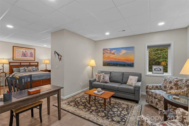 a bedroom with a bed and chair