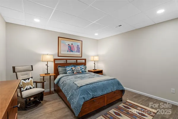 a view of staircase with wooden floor and white walls