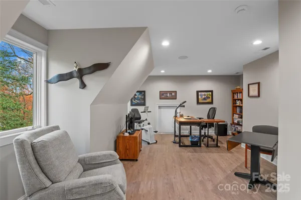 a view of a chair and tables in the patio