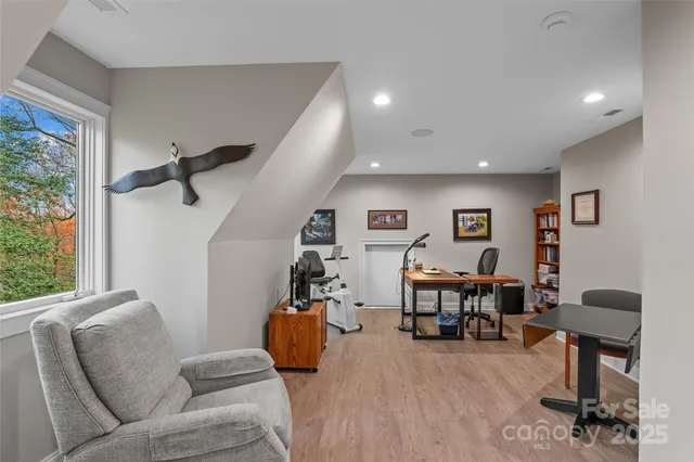 a view of a chair and tables in the patio