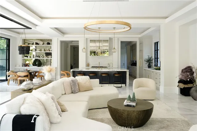 a view of a dining room with furniture water view and a floor to ceiling window