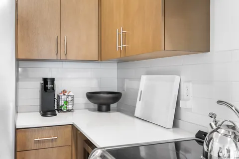 a kitchen with a sink and cabinets