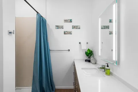 a bathroom with a sink and a mirror