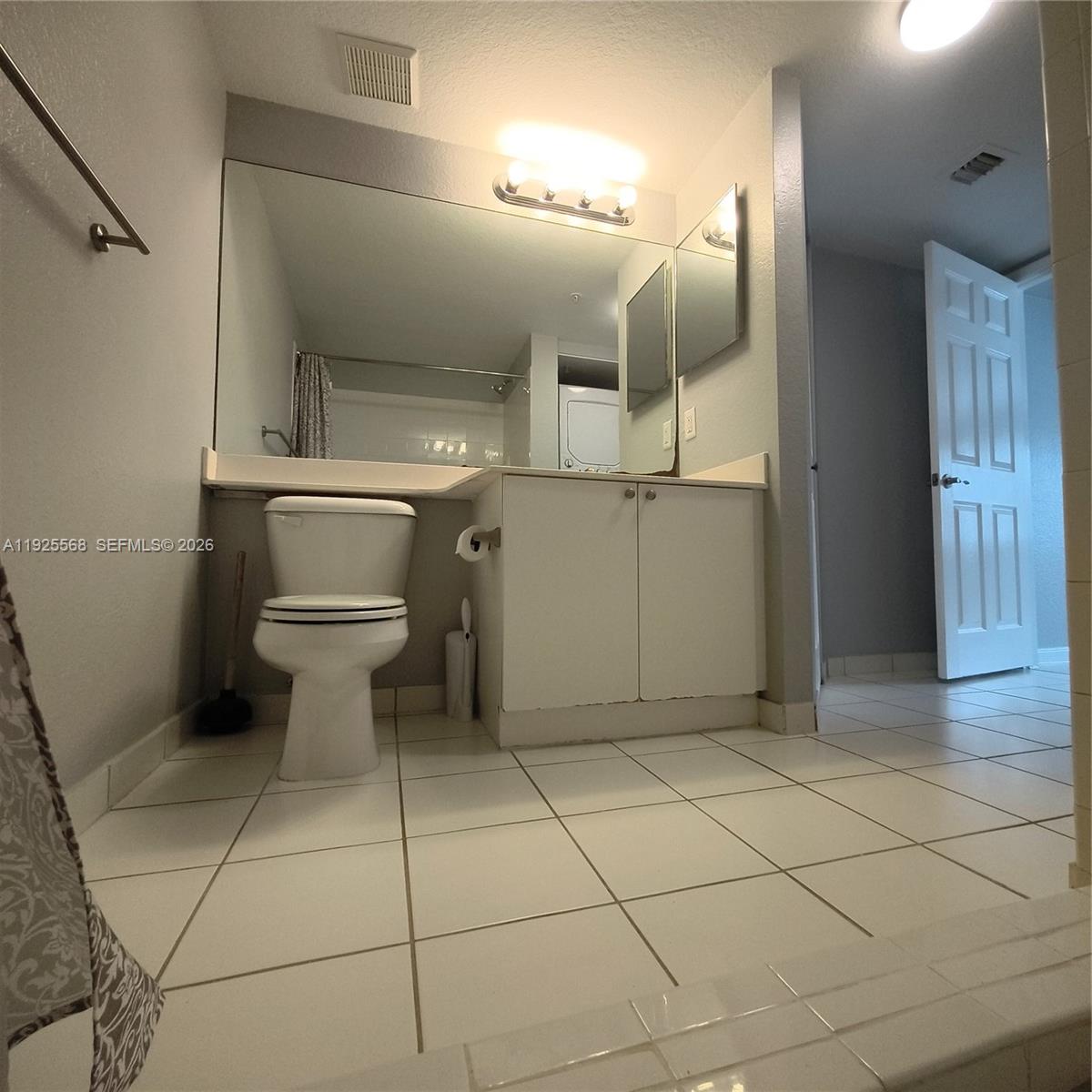 15440 Southwest 284th Street, Unit 5303 Homestead, FL 33033 - Photo 12 of 18 a bathroom with a toilet and a shower