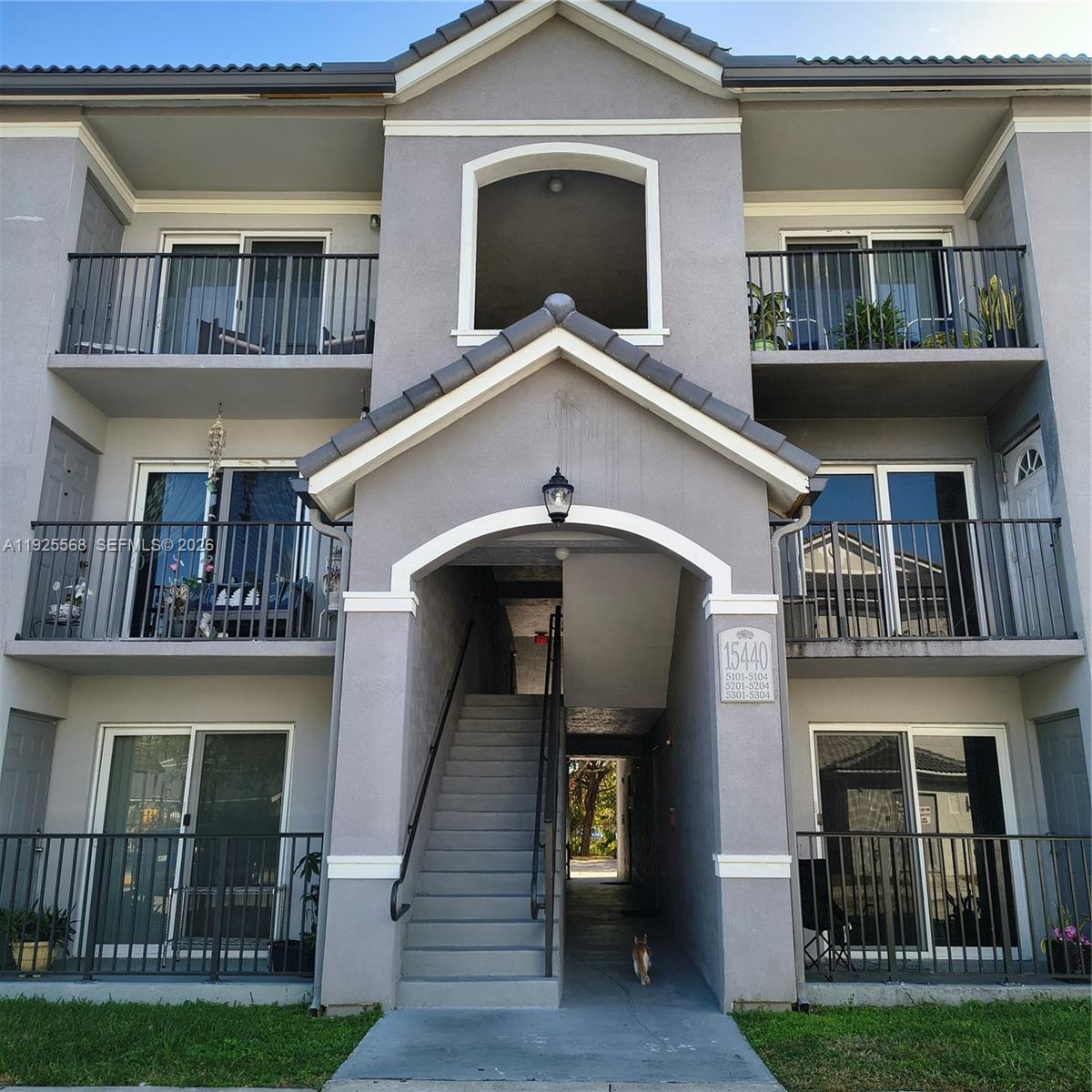 15440 Southwest 284th Street, Unit 5303 Homestead, FL 33033 - Photo 17 of 18 a front view of a house with a yard