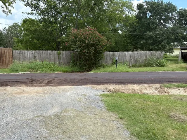 a view of a yard with a trampoline