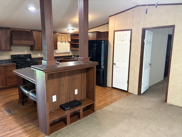 116 Taft Street Normangee, TX 77871 - Photo 19 of 33 a kitchen with stainless steel appliances granite countertop a stove and a refrigerator