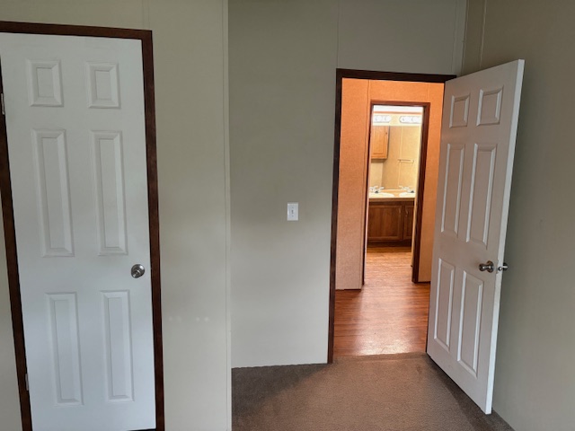 116 Taft Street Normangee, TX 77871 - Photo 24 of 33 a view of a hallway with a wooden door