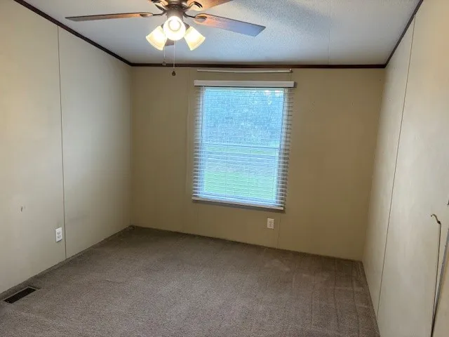 a view of a bathroom from a hallway