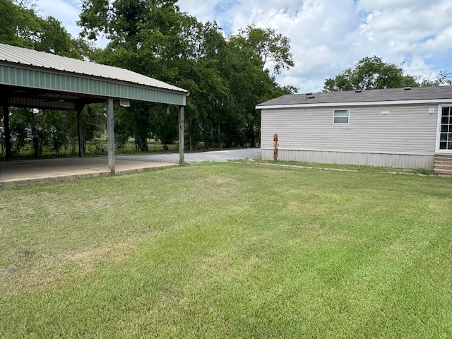 116 Taft Street Normangee, TX 77871 - Photo 6 of 33 a view of a backyard with a garden and entertaining space