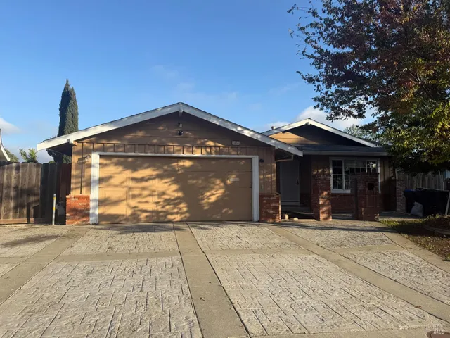 a front view of a house with a outdoor space