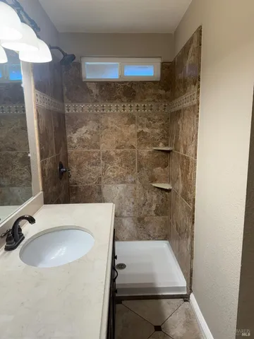 a bathroom with a sink and a mirror