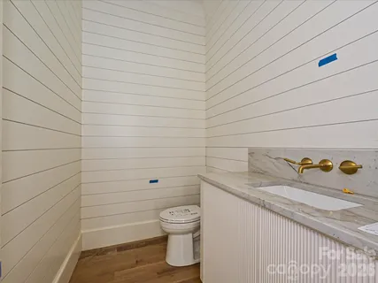 a bathroom with a toilet and a sink