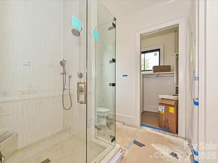 a bathroom with a shower and a sink