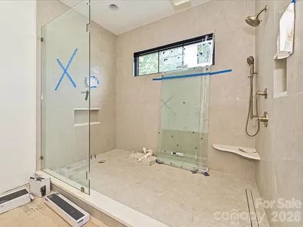 a bathroom with a tub and a shower