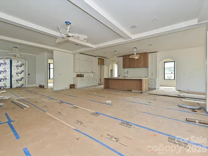 a view of a living room and kitchen area